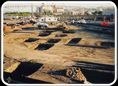 Construction site seen from height, with foundations laid out.